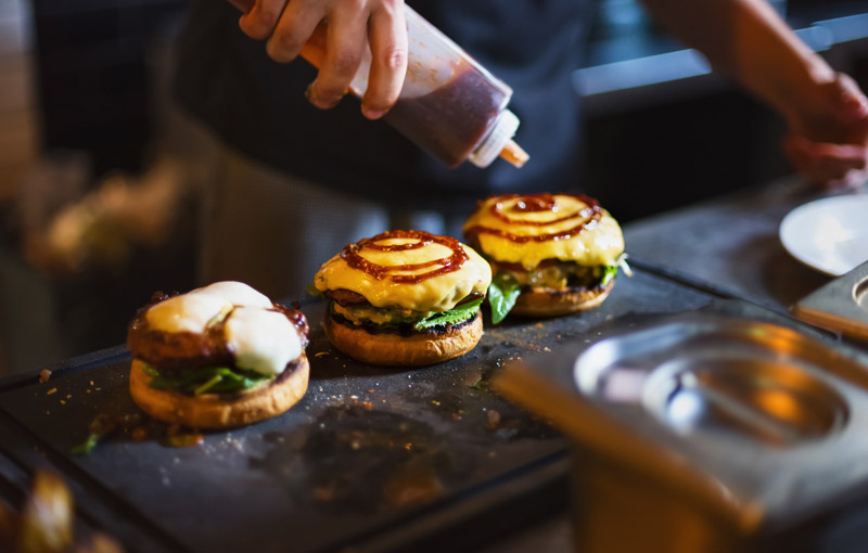 Restaurant operators are serving customers with burgers