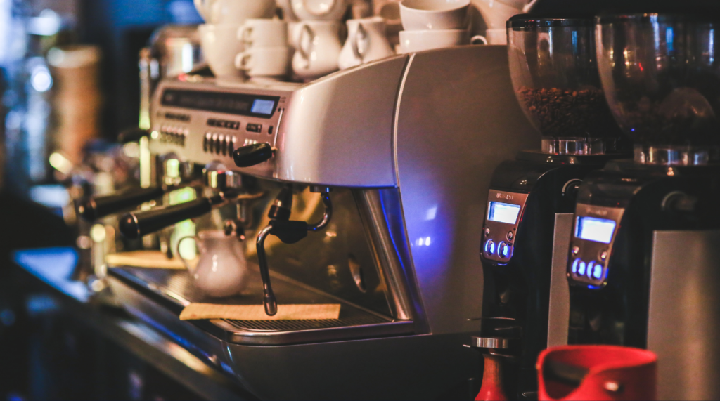 close up shot of a coffee machine, coffee grinders, and other equipment